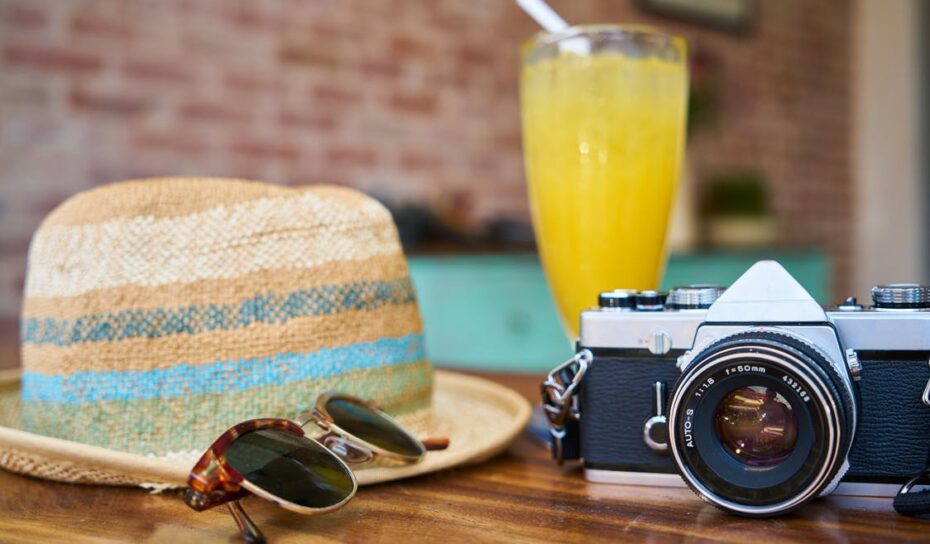 hat sunglasses cocktail camera