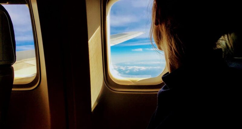 plane window with person plane window with person