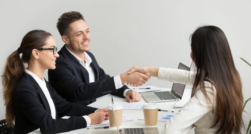friendly-partners-handshaking-group-meeting-thanking-successful-teamwork-scaled.jpg